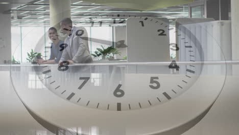 animation of clock moving over diverse colleagues discussing work