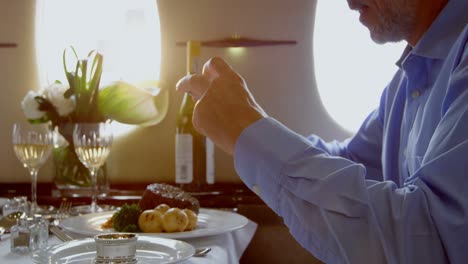 businessman taking photo of meal with mobile phone 4k