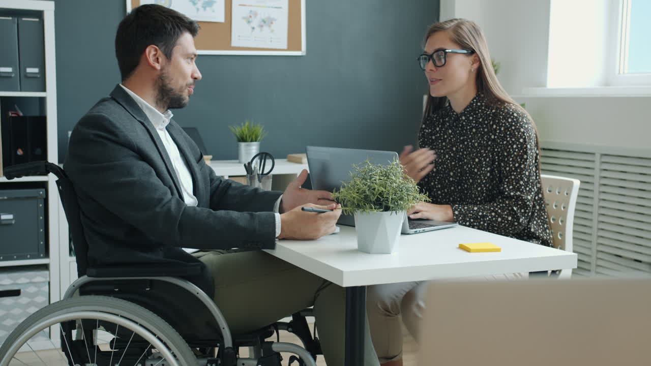 Business Meeting with Person in Wheelchair