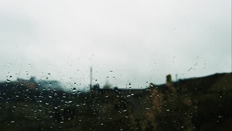 raindrops on the window, a thunderstorm outside the window, rain is running down the glass. time lapse of rain.