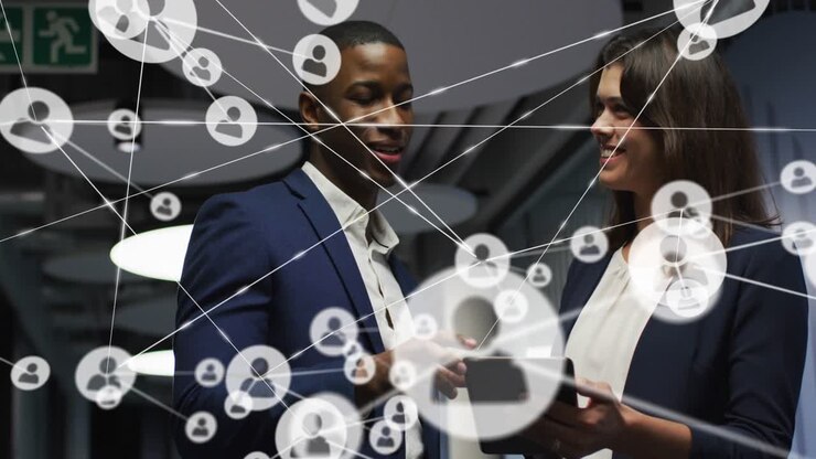Man tapping tablet, woman holding tablet in business corridor, network nodes expanding to map links