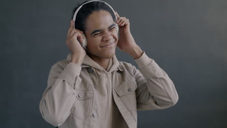 young man listening to music and dancing