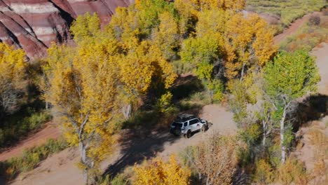 Off-road-vehicle-driving-through-Bentonite-Hills-National-Park,-Utah-in-USA