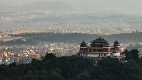 Kathmandu-City-from-Kapan-Buddhist-Monastery-Nepal,-Drone-shot,-Urban-City-with-Airport-and-buildings