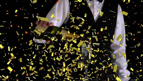 Golden-confetti-falling-over-mid-section-of-bartender-pouring-champagne-into-a-glass