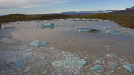 flying over the glacier lagoon of svinafellsjokull glacier in iceland