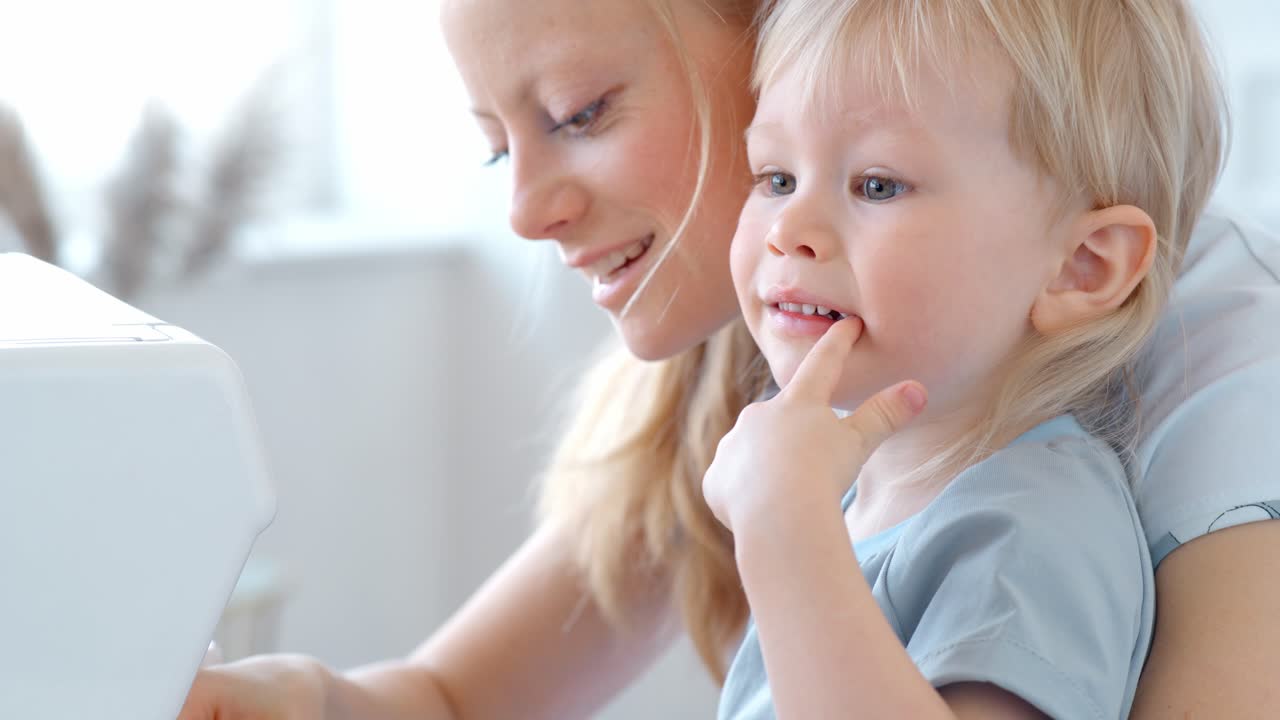 Mother and Child Learning to Sew Together