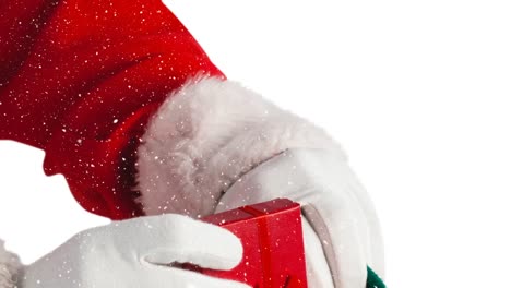 animation of snow falling over santa claus holding gift