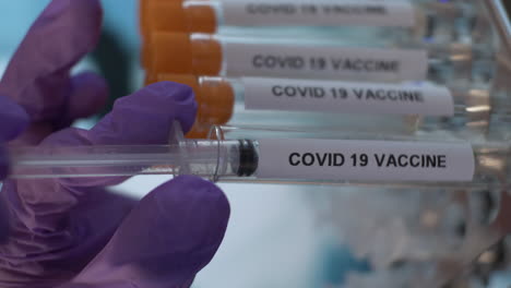 Nurse-Using-Syringe-To-Fill-Up-Coronavirus-Covid-19-Vaccine-From-Test-Tube-Vial