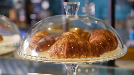 croissants in a glass dome