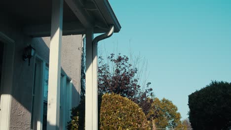 Static-establishing-shot-of-the-porch-and-bushes-in-front-of-a-San-Diego-home