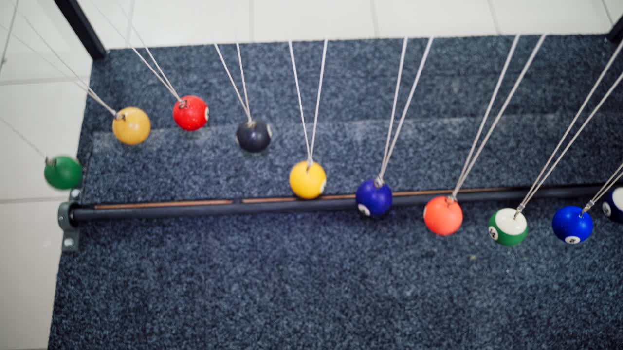 Balancing balls of Newton's cradle. Museum of Science