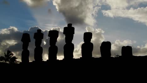 clouds lend an air of mystery to the amazing statues at easter island