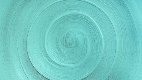 close-up view seamless looping rotation of spiral lines. trendy aqua menthe color and abstract background of infinity with copy space