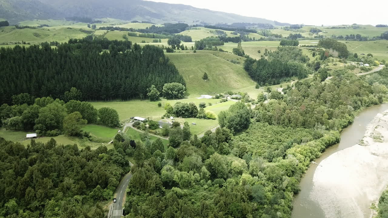 Aerial of luscious farmland and river terraces in Spring - Manawatu New Zealand