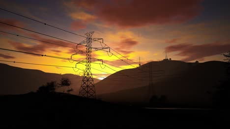 the high voltage electricity tower on mountains at sunset. 4k time lapse of sunset with transmission electricity steel pylon tower, electricity pylons in the countryside