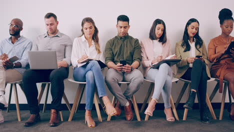 a group of young businesspeople waiting in line