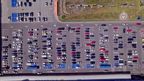 drone aerial footage top down view of a large supermarket parking lot