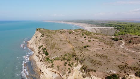 Porto-Novo-and-Hidrovor-Beach,-Albania---Aerial-of-Coastline-with-Cliffs,-Long-Sandy-Beach-and-Van