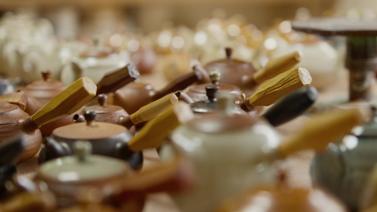 Handcrafted Ceramics, Extensive Collection of Unique Teapots in a Pottery Workshop Setting.