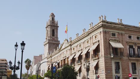 Gothic,-colonial-Architecture-with-spanish-flag-Valencia-Spain-4k-24fps