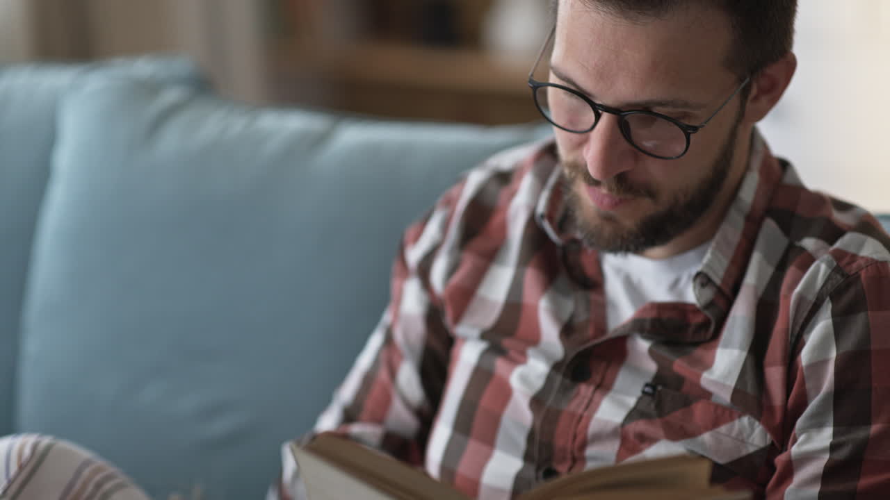 Man and woman reading together at home