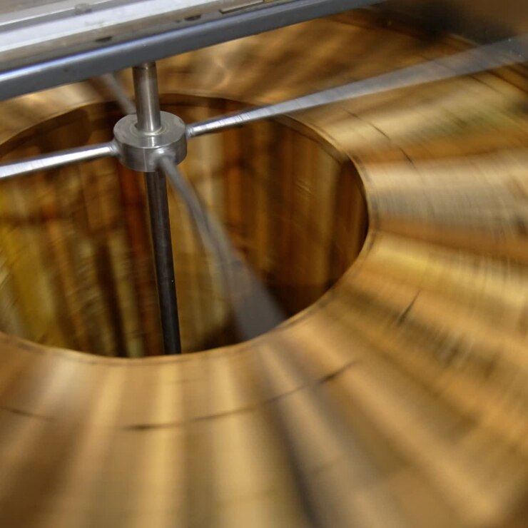Honey extracting machine working. Honey frames are rotated in the apparatus to get fresh organic product. Close up