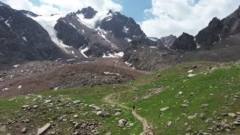 view of kazakhstan glacier at medeu symbulak with snow and rocky peaks