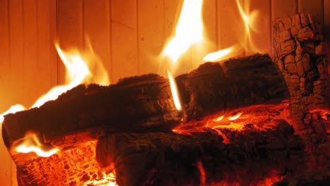 Burning-Flame-At-Fireplace-on-wooden-logs