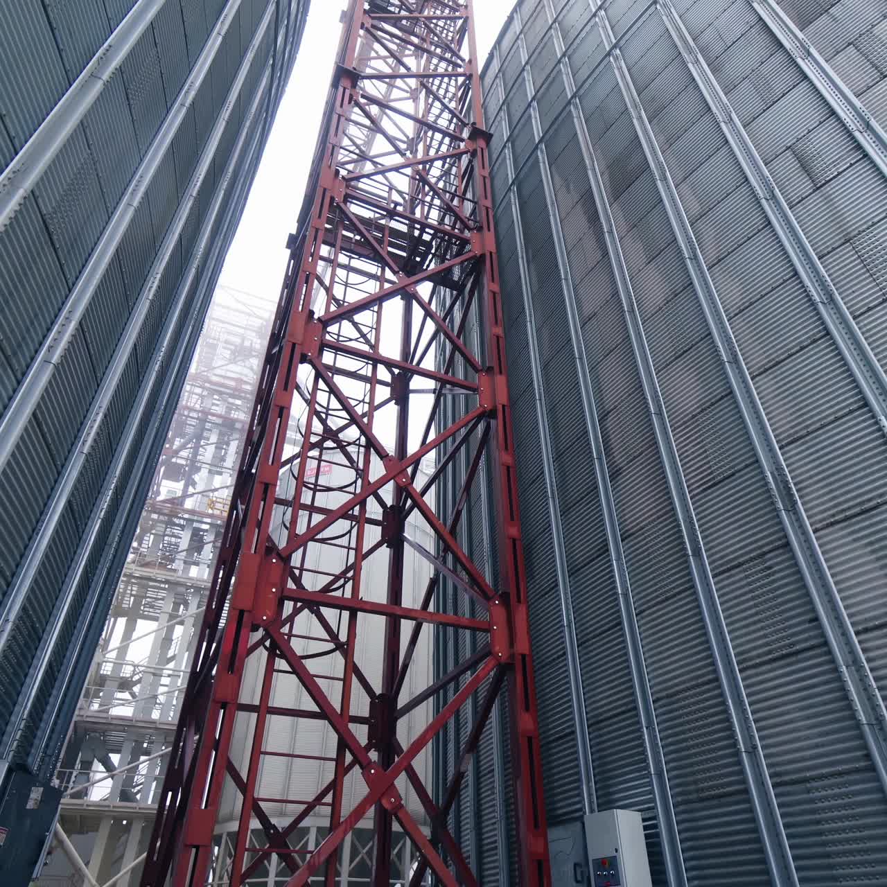 Big steel elevator construction storage. Industrial agriculture farming equipment