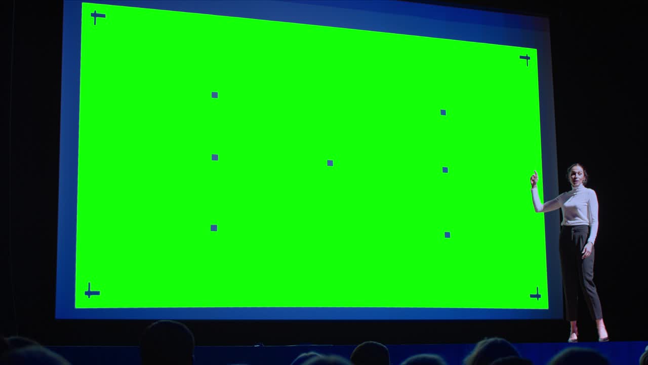 Business Conference Stage: Female Keynote Speaker Presents New Product to the Audience, Movie Theater Shows Green Screen, Mock-up, Chroma Key. Live Event on Health, Technology and Science