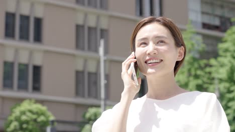 a woman talking on a smartphone