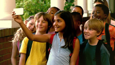 Cute-pupils-taking-a-selfie-in-the-corridor