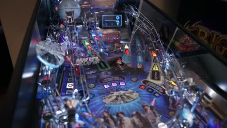 closeup shot of a star wars themed pinball gaming machine