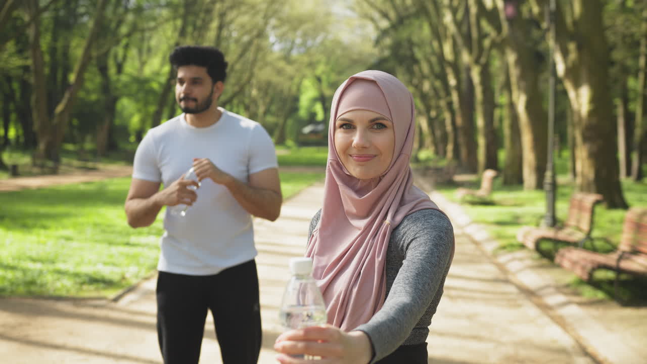 Couple exercising in a park