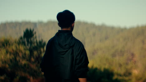 person looking at the mountains