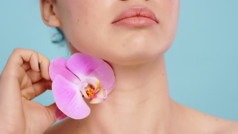 woman, orchid flowers and body for skincare