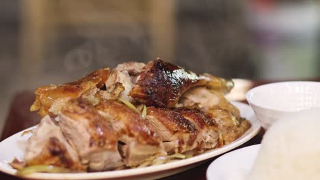 close-up of roasted duck served with rice