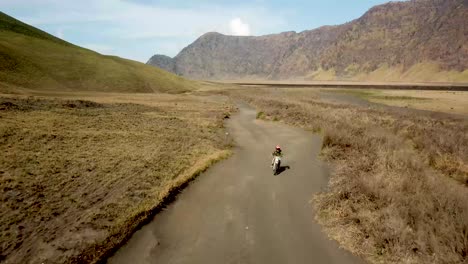 drone shot of a crossbike around bromo volano in indonesia