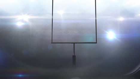 animation of american football goalposts and cloudy sky at floodlit stadium