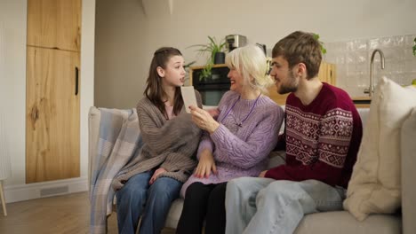 family gathering looking at a photo