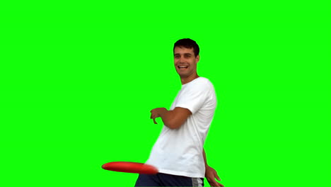 Hombre-Lanzando-Un-Frisbee-En-Pantalla-Verde