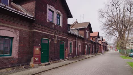 a shot of the street and red brick houses of the former 19th century workers' colony in ostrava vítkovice