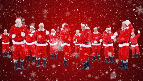 copos de nieve cayendo sobre varios santa claus bailando contra un fondo rojo