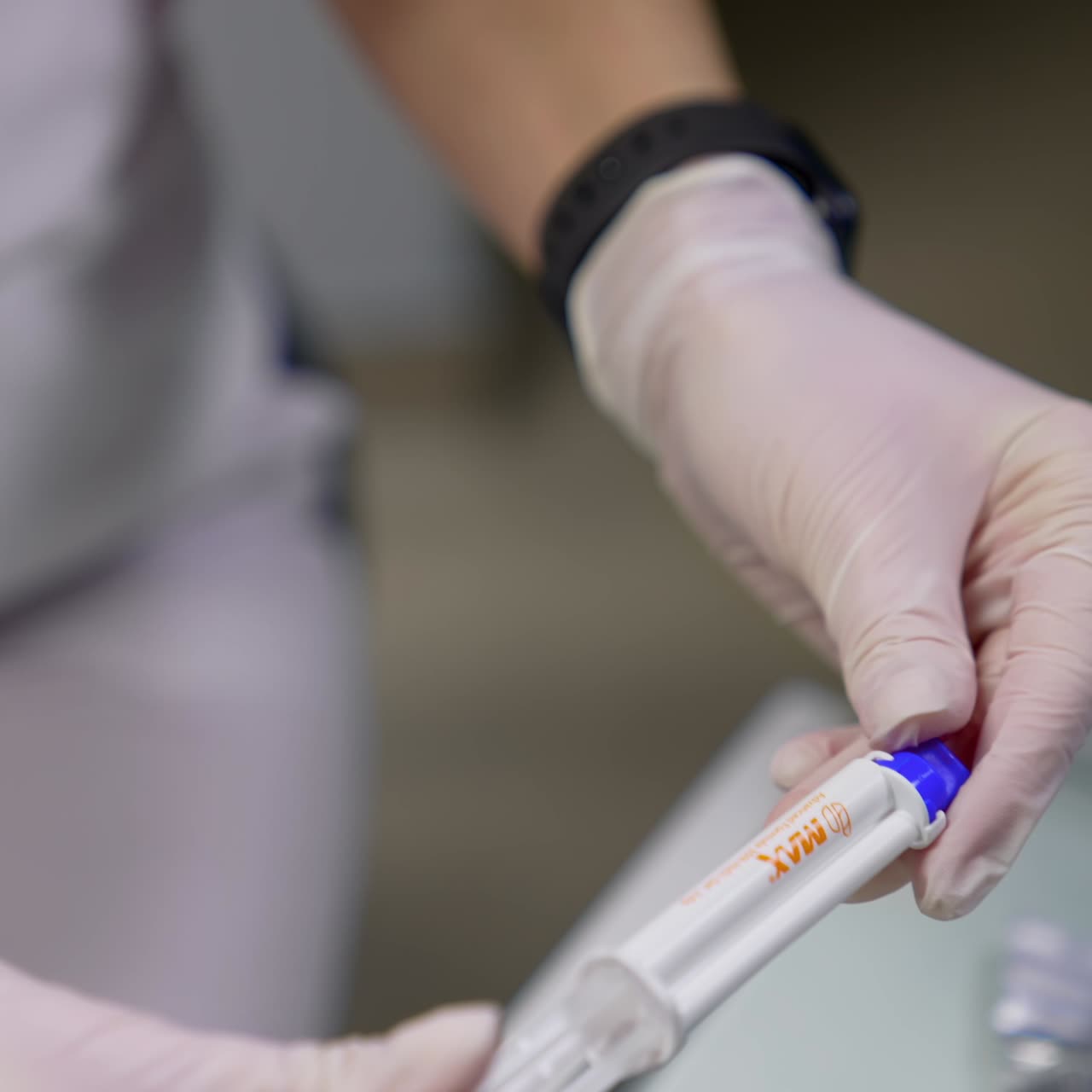 Woman dentist in dental office. Doctor holding instrument tool for oral examination