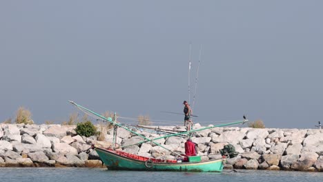 a fisherman on a boat casting his fishing line