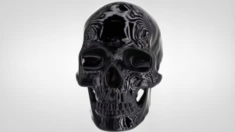 a black, glossy skull with an intricate swirling pattern on a white background