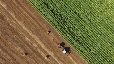 tractor straw baler in an agricultural field