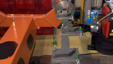 robotic arm performs precise welding, movement in factory. sparks flying during electric welded in high-tech industrial facility setting with precision power, modern manufacturing efficiency