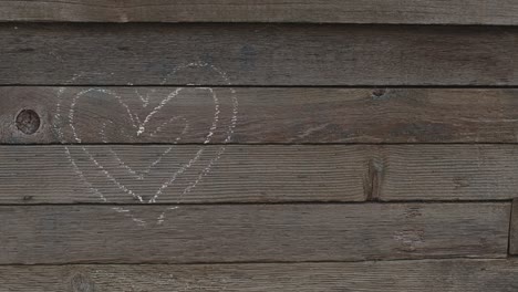 heart on a wooden plank wall